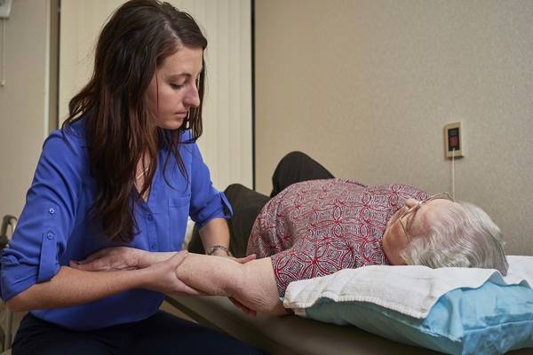 Anna working with a lymphedema patient.